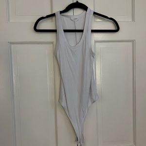 Clyque white body suit in a size small